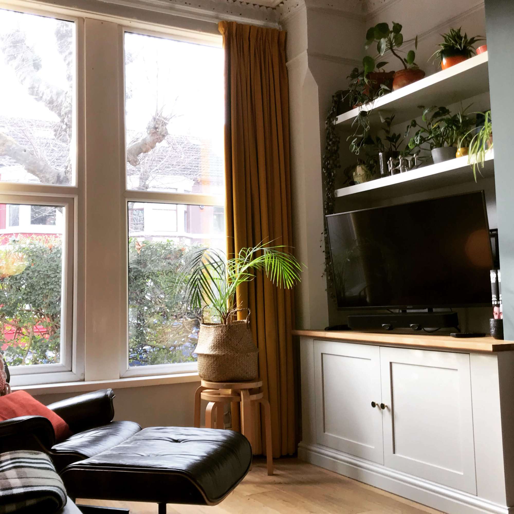alcove unit with floating shelves in living room