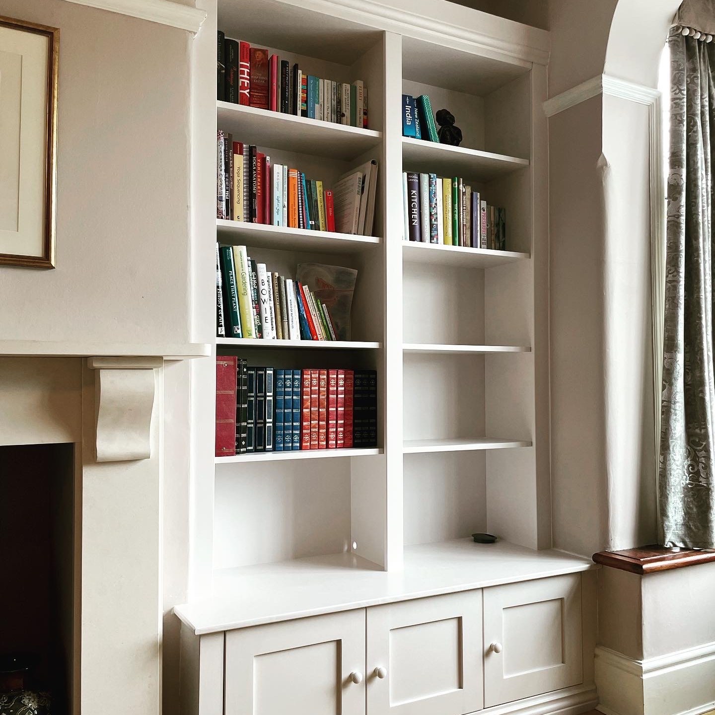 Alcove unit with lower cabinet and double bookshelf