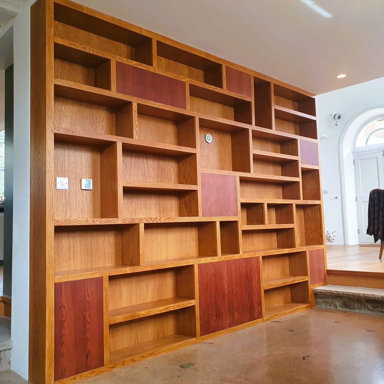 bespoke fitted shelving unit in oak vaneer