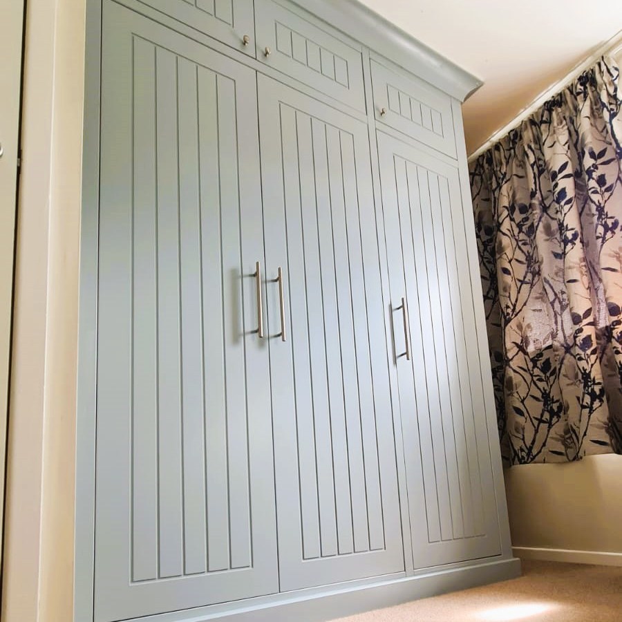 Triple wardrobe fitted with detailed finish on doors